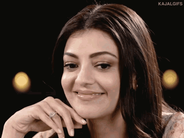 a close up of a woman 's face with the word kajal gifs written below her