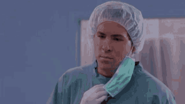 a surgeon wearing a mask and a cap says but why .