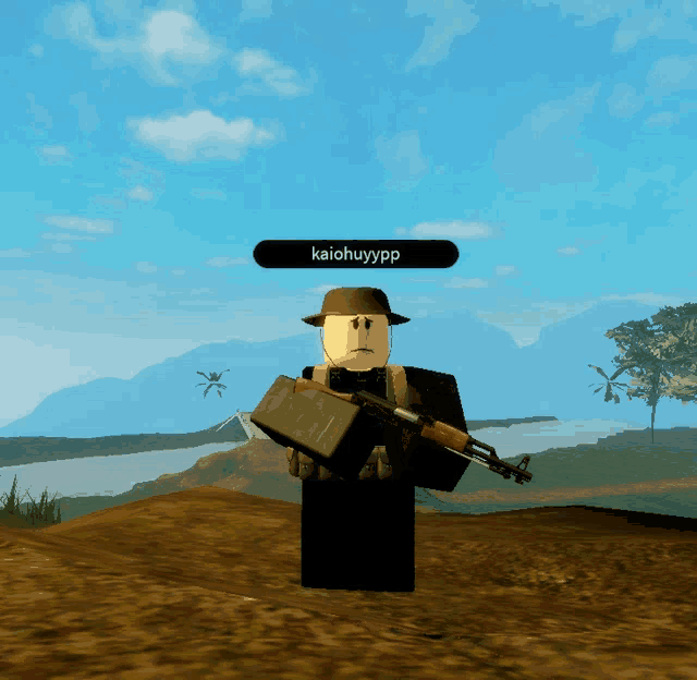 a roblox character holding a gun and a box with kaiohuyypp written above him
