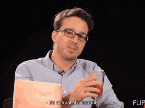 a man drinking a glass of tomato juice with the words it 's a healthy functioning human body below him
