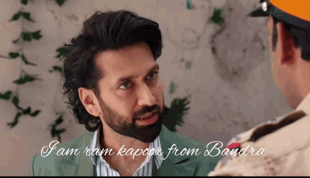a man with a beard is talking to another man with the words " jam ram kapoor from bandra " written below him