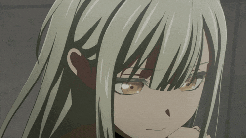 a close up of a girl 's face with white hair