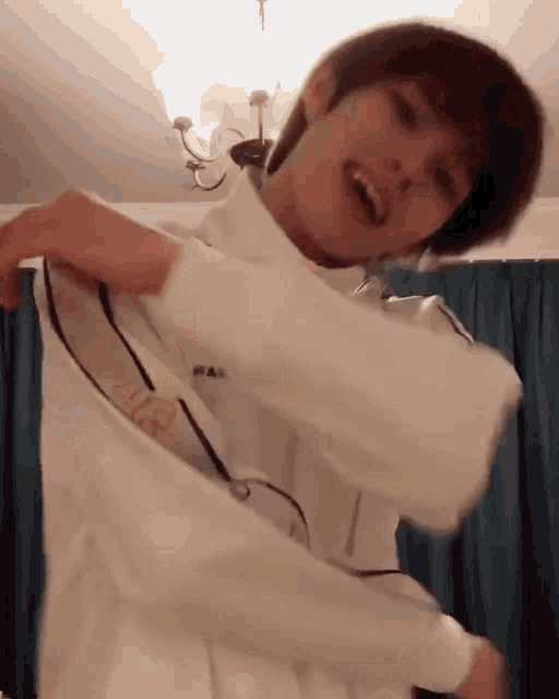 a person wearing a fila shirt is dancing