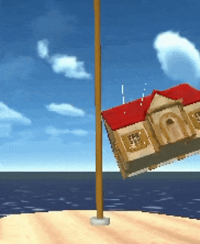 a house with a red roof hanging from a pole