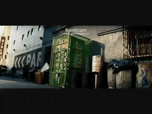 a green phone booth with the word paf painted on the side of it