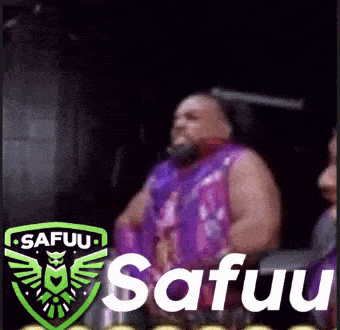 a man in a purple shirt is sitting in a chair with the word safuu on the bottom .