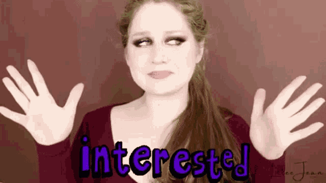 a woman is making a funny face with the words interested written on the bottom