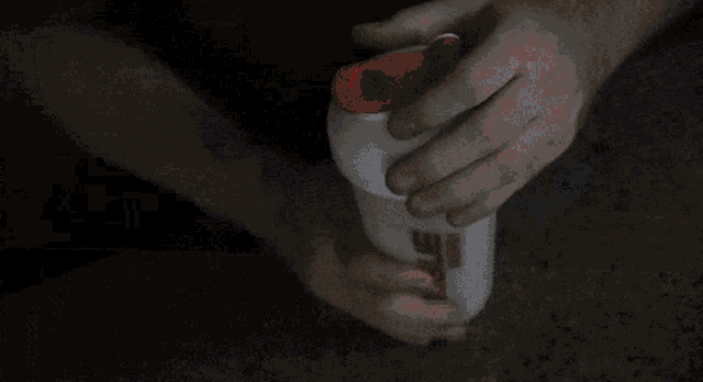 a rogue energy drink container is sitting on a carpet