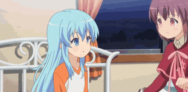a girl with blue hair is sitting next to a girl with red hair