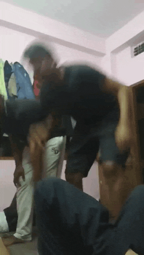 a blurry photo of a group of people dancing