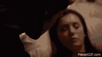 a close up of a man 's face with his eyes closed on make a gif .