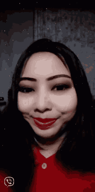 a close up of a woman 's face with a phone icon in the lower right corner