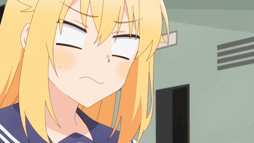 a close up of a blonde anime girl making a funny face
