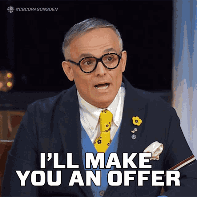 a man wearing glasses and a suit says i 'll make you an offer