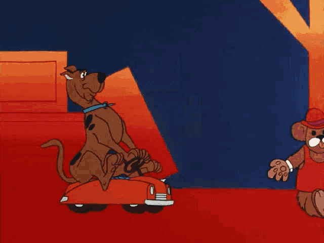 scooby doo is carrying a stack of boxes in a red car