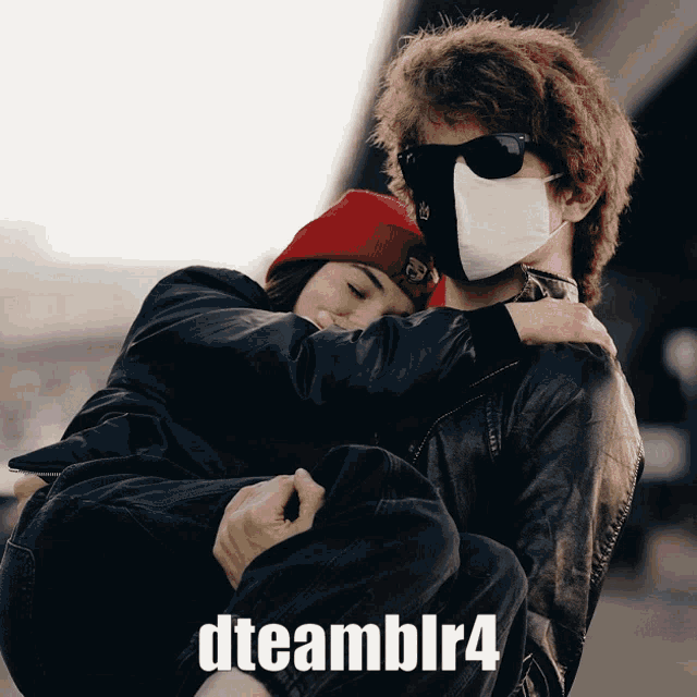 a man wearing a mask is carrying a woman in his arms with the hashtag dteamblr4