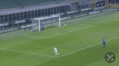 a soccer player wearing number 77 runs towards a goal