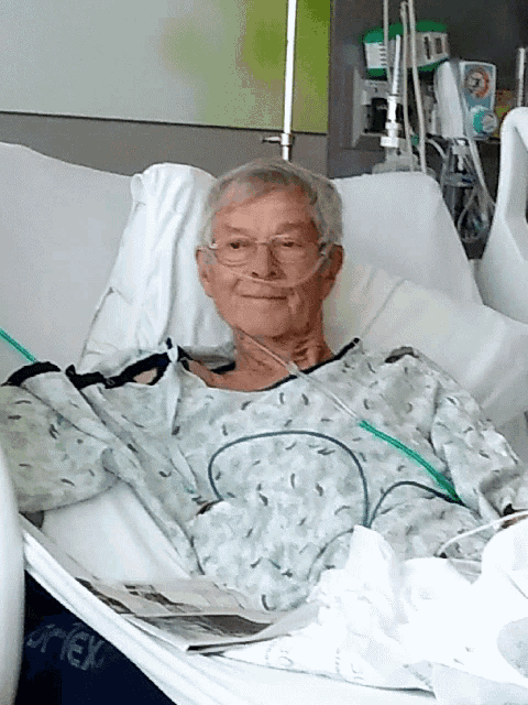 an elderly man is laying in a hospital bed with the word trek on the bottom