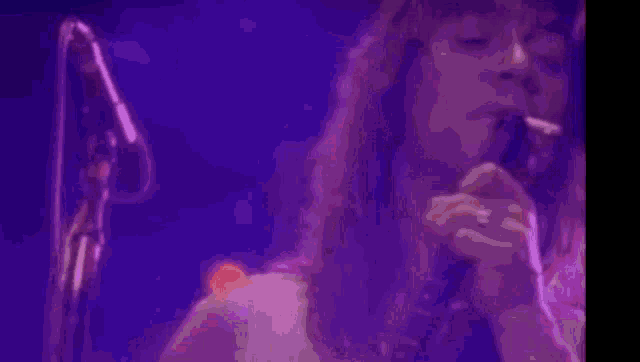 a woman with purple smoke coming out of her nose