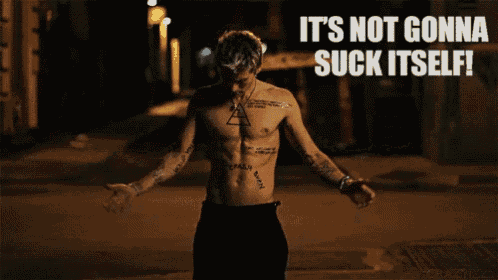 a shirtless man is standing in front of a sign that says " it 's not gonna suck itself " on it