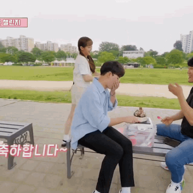 a group of people sitting on a bench with a sign that says lict