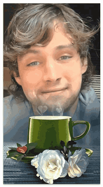 a picture of a man with a cup of coffee and roses