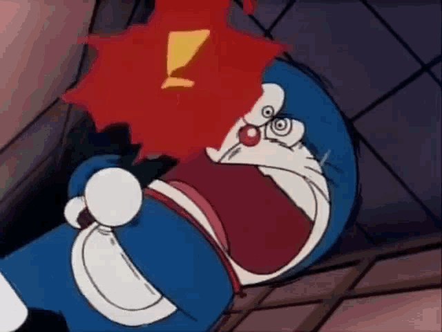 a cartoon character is holding a red object in his hand and making a funny face .