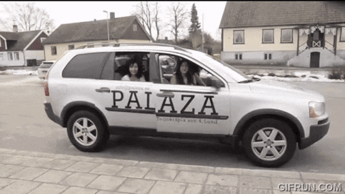 a white suv with palaza written on the side