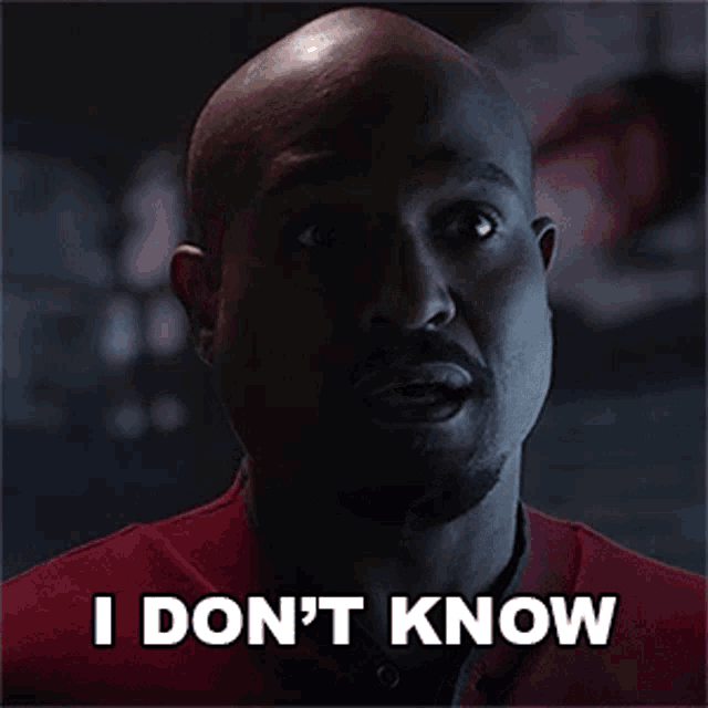 a bald man with a beard and mustache is smiling and saying `` i don 't know '' .