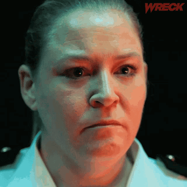 a close up of a woman 's face with the word wreck in the corner