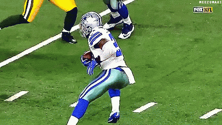 a football player in a cowboys uniform is running with the ball on the field .