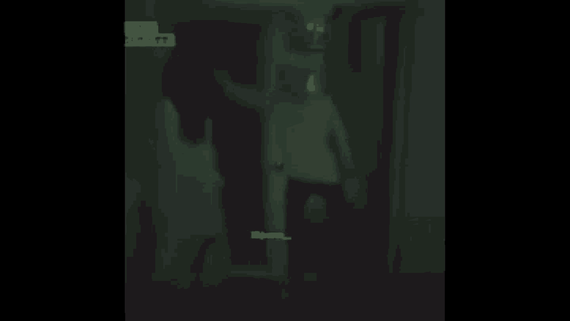 a blurry picture of a person in a dark room with chinese writing