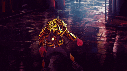a person in a tiger mask is holding a yellow explosion in their hand