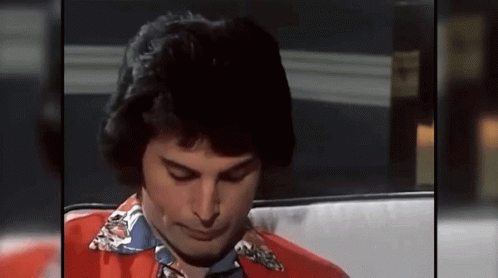 Freddie Mercury Listening GIF - Freddie Mercury Listening Scratch Face GIFs