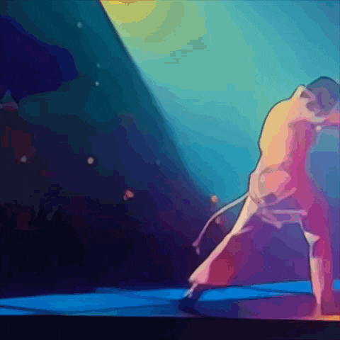 a man is dancing on a stage with a spotlight on him