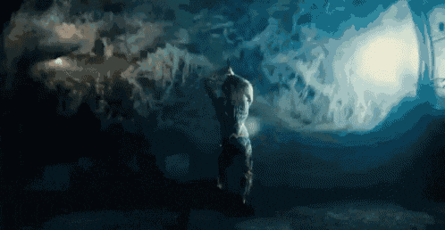 a person standing in a dark room with smoke coming out of the ceiling