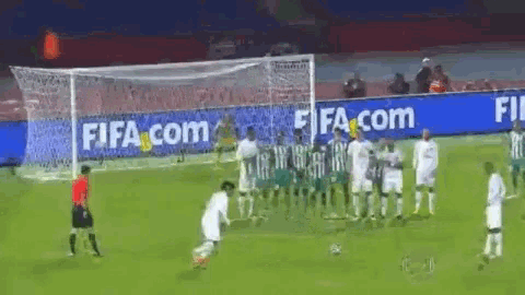 a soccer game is being played in front of a fifa.com banner