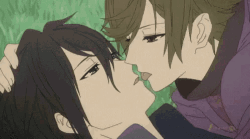a couple of anime characters are kissing each other in the grass .