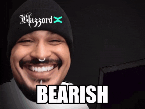 a man with a beard wearing a black beanie with the word blazord on it