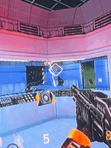 a person is holding a gun in a video game and the number 5 is on the screen