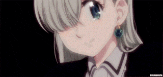 a close up of a girl wearing earrings and a collar .