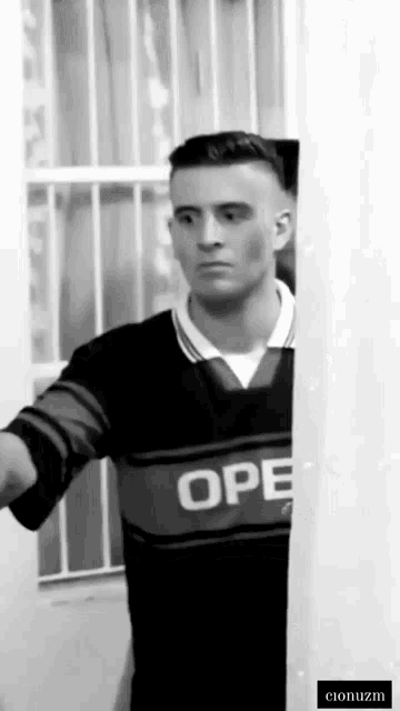 a man wearing a shirt that says ope on it