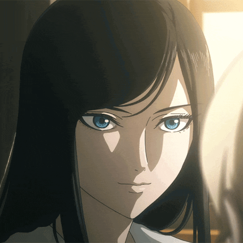 a woman with long black hair and blue eyes