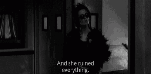a black and white photo of a woman wearing sunglasses and the words and she ruined everything .