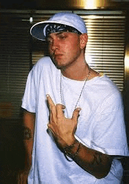 a man wearing a hat and a bandana is making a middle finger sign .