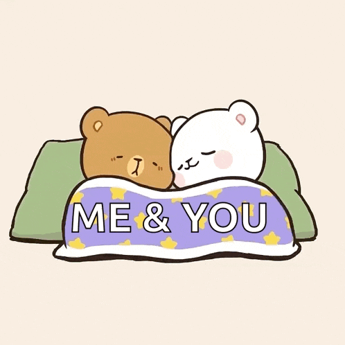 a couple of teddy bears laying under a blanket that says me and you
