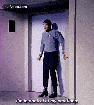 a man in a star trek uniform is standing in front of an elevator and saying i 'm in control of my emotions