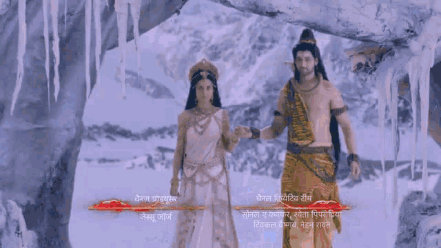 a man and a woman are holding hands with bracelets on