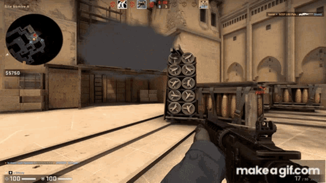 a person holding a gun in a video game with a make a gif.com watermark on the bottom right