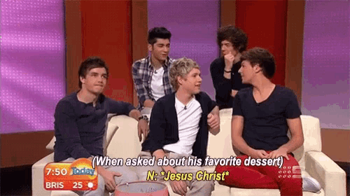 a group of boys are sitting on a couch and one of them is talking about his favorite dessert
